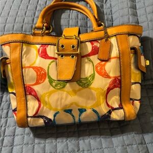 Coach Multicolor Satchel with Yellow leather Accents.